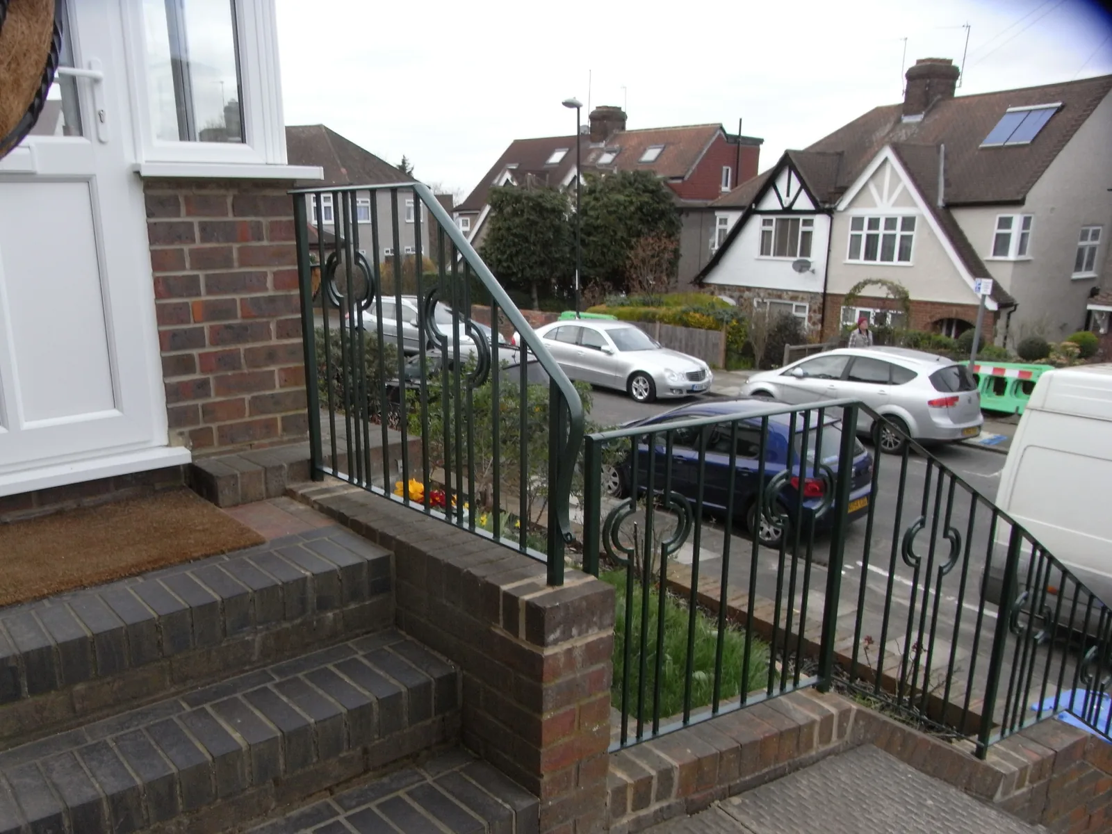 Hand rail to steps to front entrance, photo 3 of 4